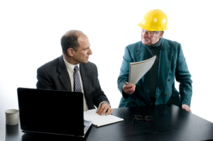 A construction advice sitting at table and giving advice to an attorney