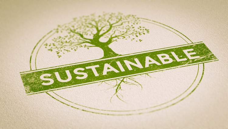 Green Sustainable stamp over paper